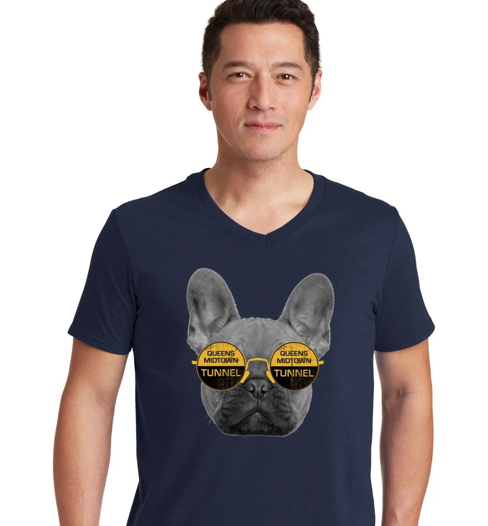 Man wearing a navy blue v-neck t-shirt with a graphic of a dog wearing sunglasses and text.
