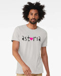 Man wearing an off-white t-shirt with 'astoria' stylized text and pink heart 