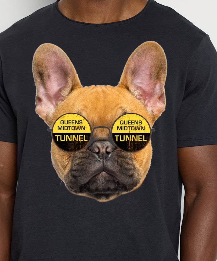 Male wearing a gray t-shirt with graphic of dog wearing glasses that say "Queens Midtown Tunnel".