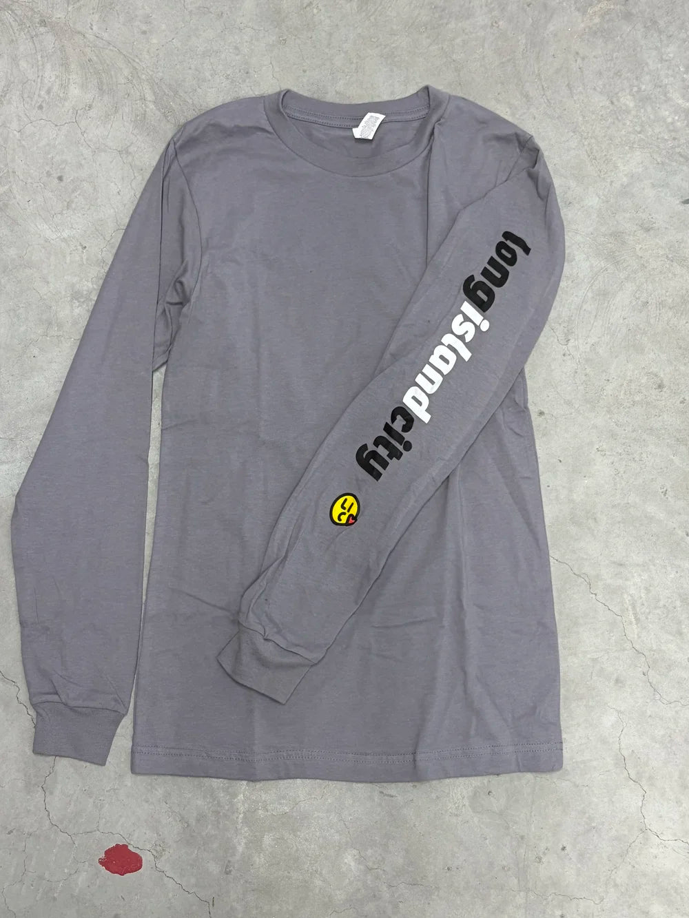 Gray long-sleeve shirt with 'Long Island City' graphic print on sleeve