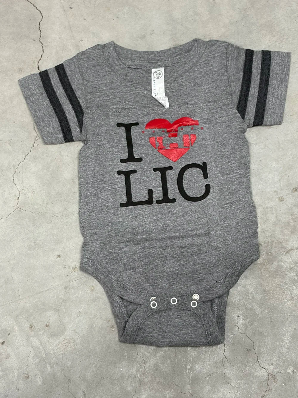 Gray baby onesie with 'I heart (in red) LIC' print