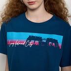 Person wearing a blue t-shirt with 'Long Island City' graphic design.