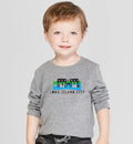 Child wearing a gray long-sleeve shirt with 'Long Island City' design on a plain background